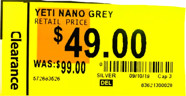 A store clearance tag reading YETI Nano Grey, $49.00, was $99.00